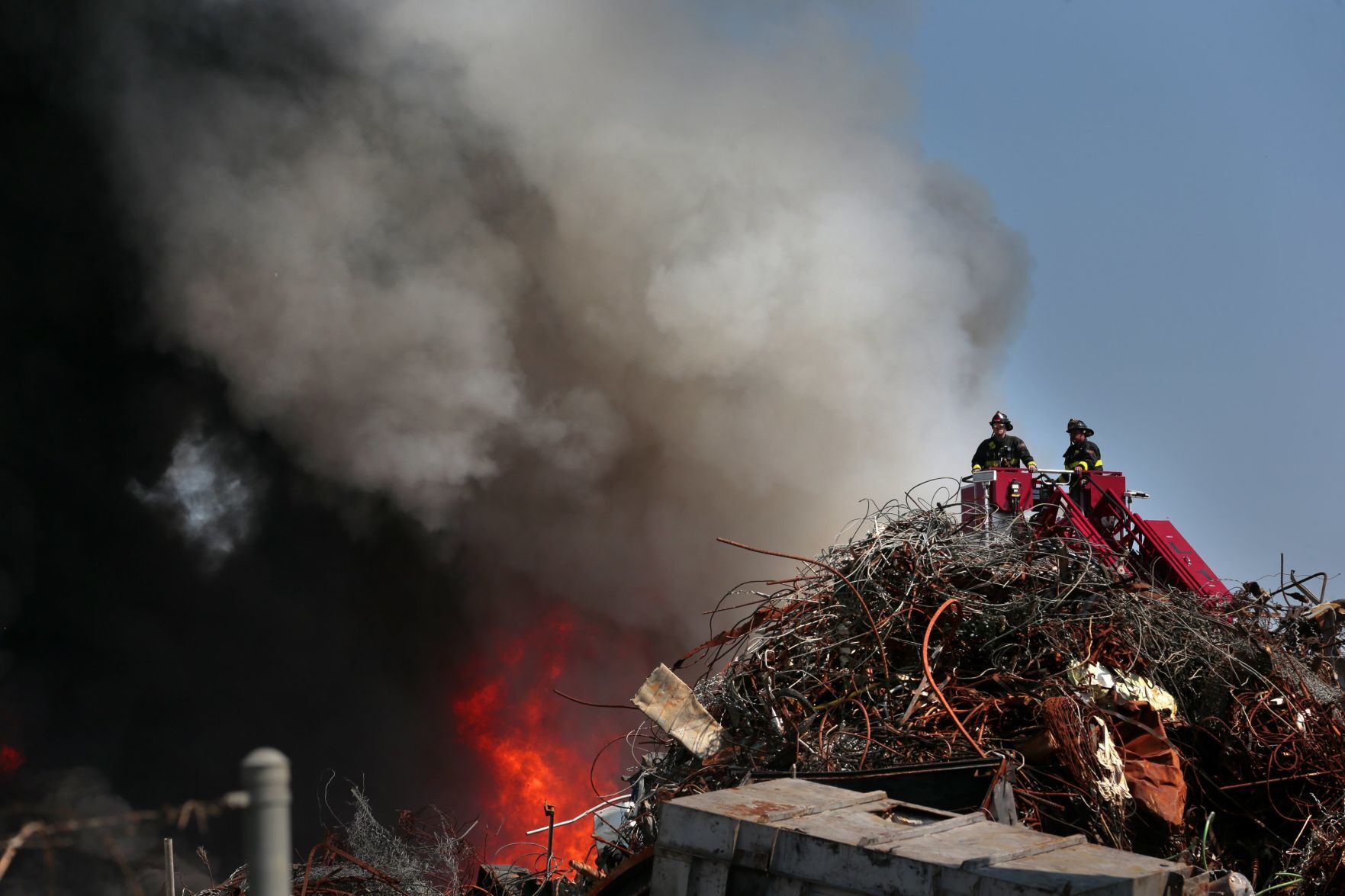 Huge plume of smoke north of downtown reveals scrap metal fire